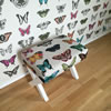 Motýlový taburet - Motýlový taburet - tento krásný taburet, který navrhla designérka Hana Kroupová, jsme očalounili zákazníkem dodanou látkou s motýly. Dřevěnou podnož si dodal také zákazník.